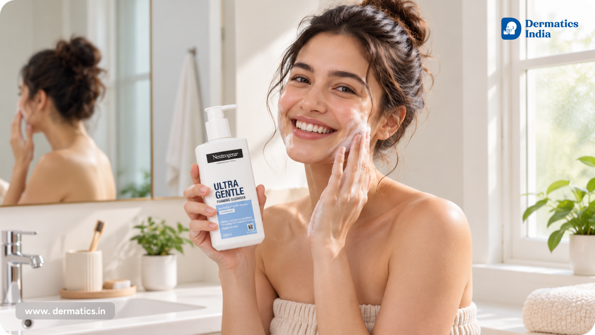 Woman smiling while washing her face with Neutrogena Ultra Gentle Foaming Cleanser, a face wash for dry skin